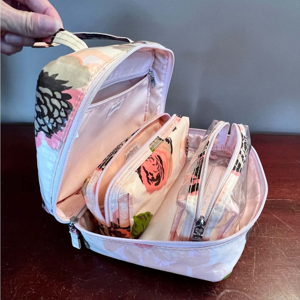 Travel makeup bag with two removable zippered pouches.